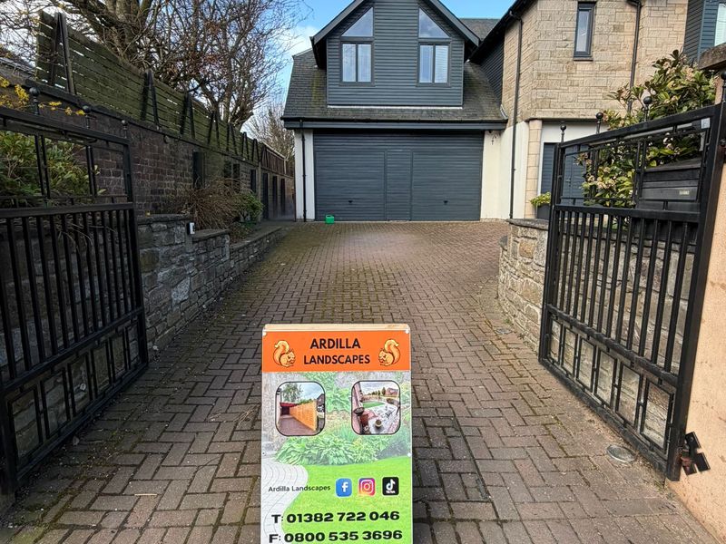 Stained block paving driveway before jet washing in Dundee